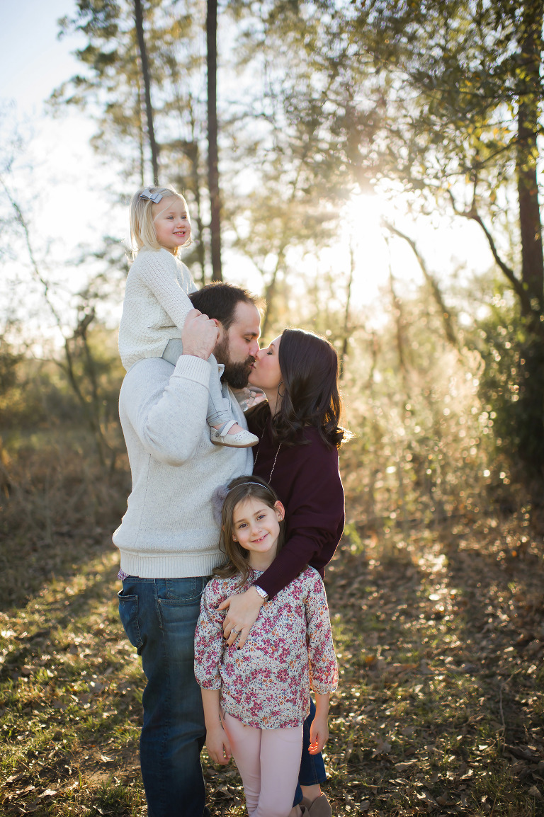 Family of four enjoying the outside session with Maricruz Photography. 