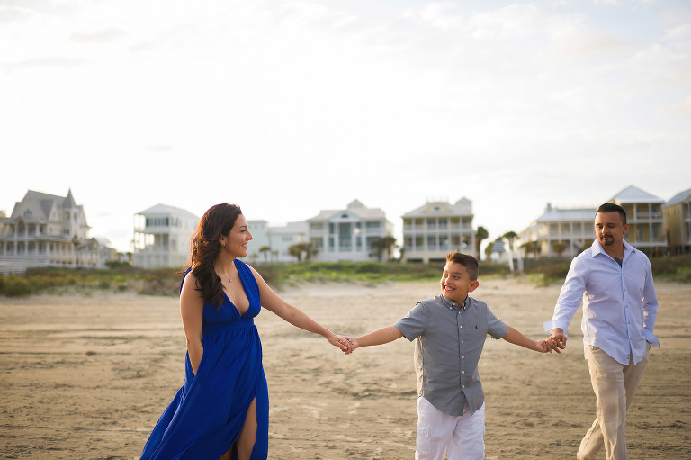 Holding hands and walking to the beach in Galveston Texas.